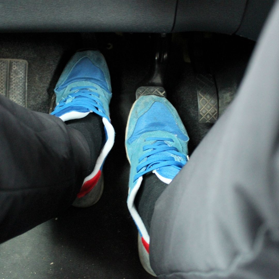 feet working car's pedals